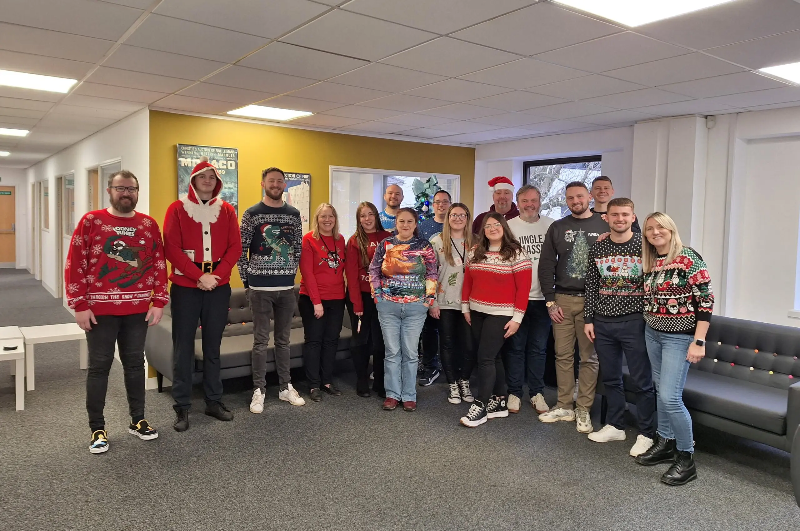 Tradesure Insurance employees wearing Christmas jumpers for the Save the Children Charity Day in December 2023