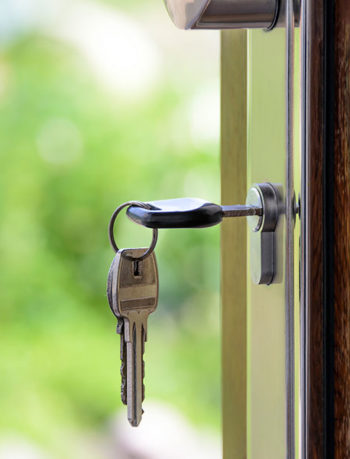 Key in front door | Home insurance for motor traders